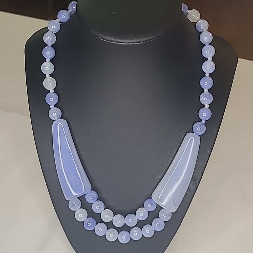 Elegant Blue Necklace with Translucent Beads and Curved Centerpieces